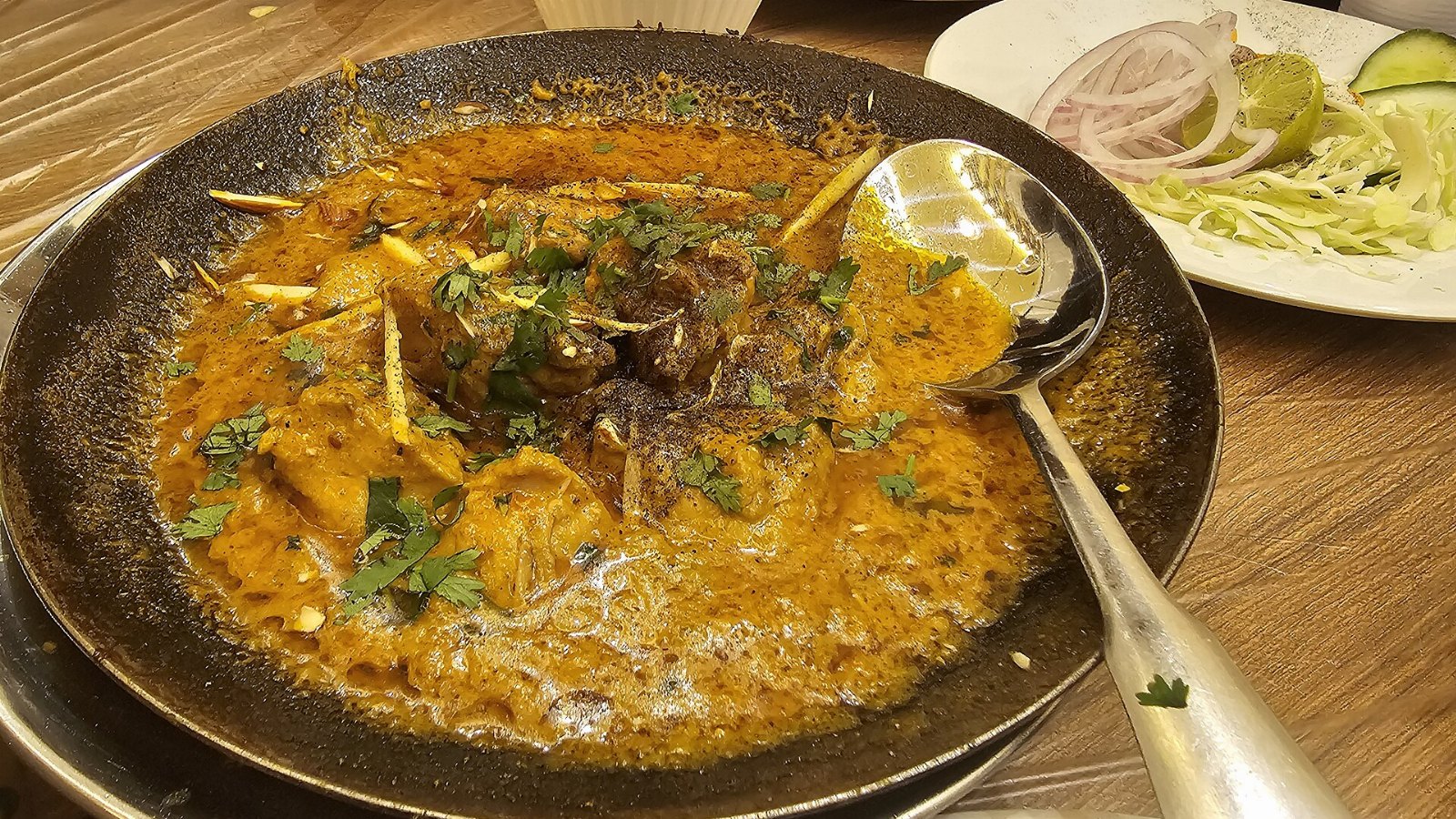 Lamb Rogan Josh served in a sizzling hot plate